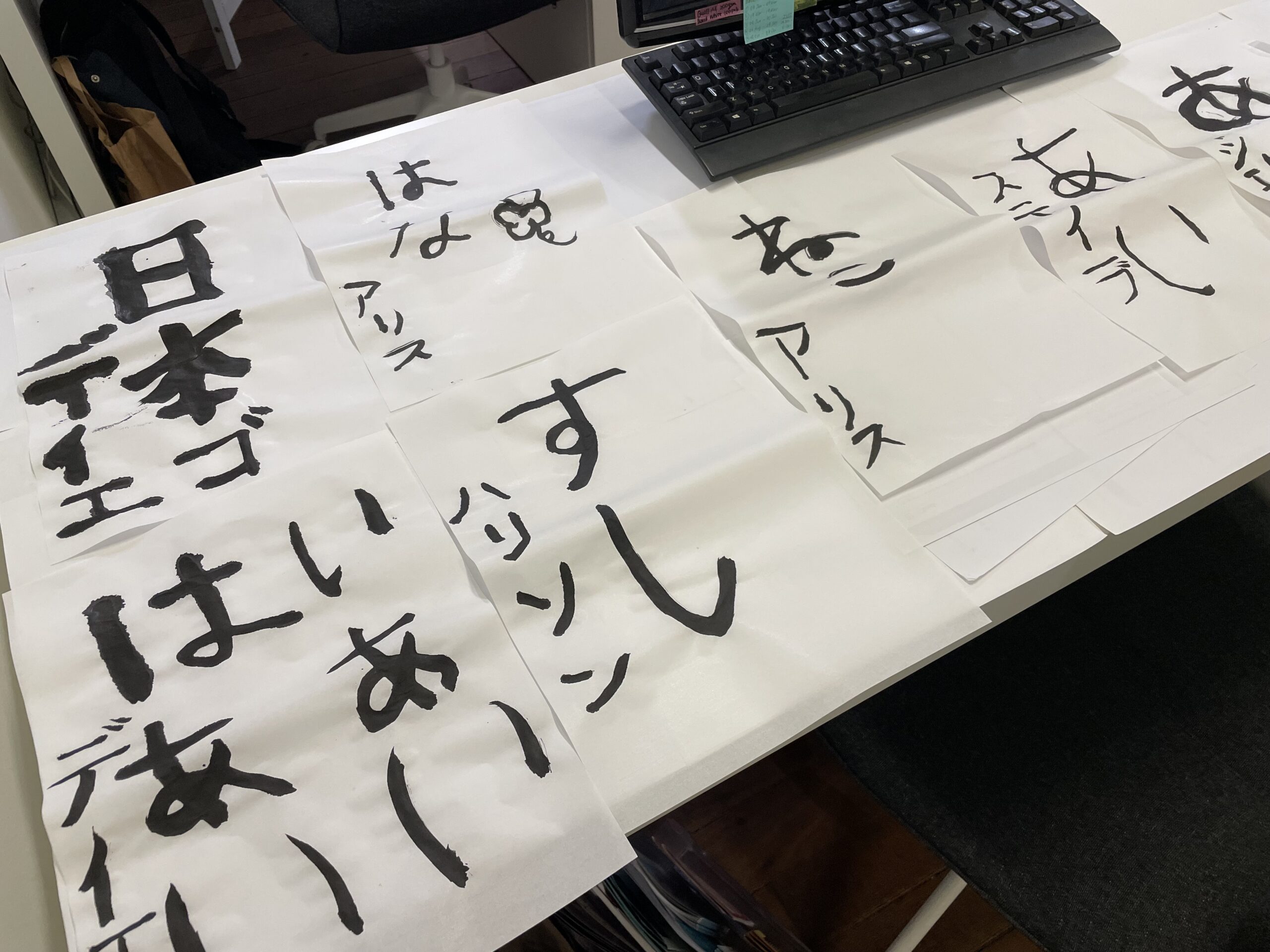 Origami cranes and calligraphy brush on warm paper